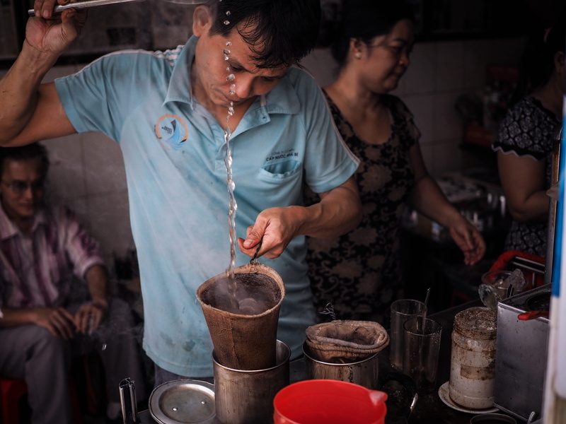 pottery, traditional coffee, group of people, food, restaurant, human, person, kitchen utensil, coffee cup, bar counter, indoors, coffee racquet, beverage