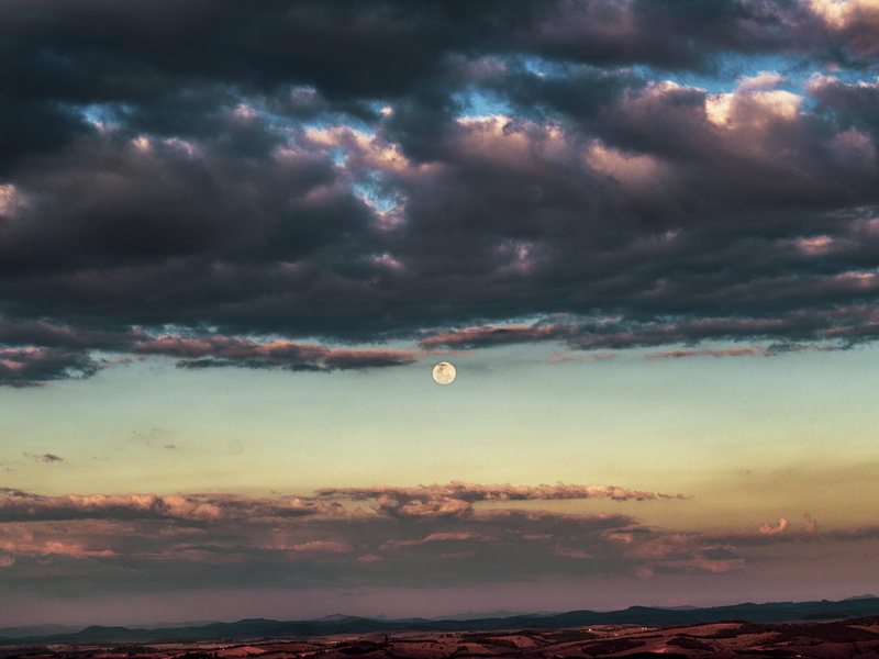 dusk, cloud - sky, mountain, sky, moon, outdoors, mid-air, mode of transportation, beauty in nature, tranquility, dramatic sky, tranquil scene, adventure