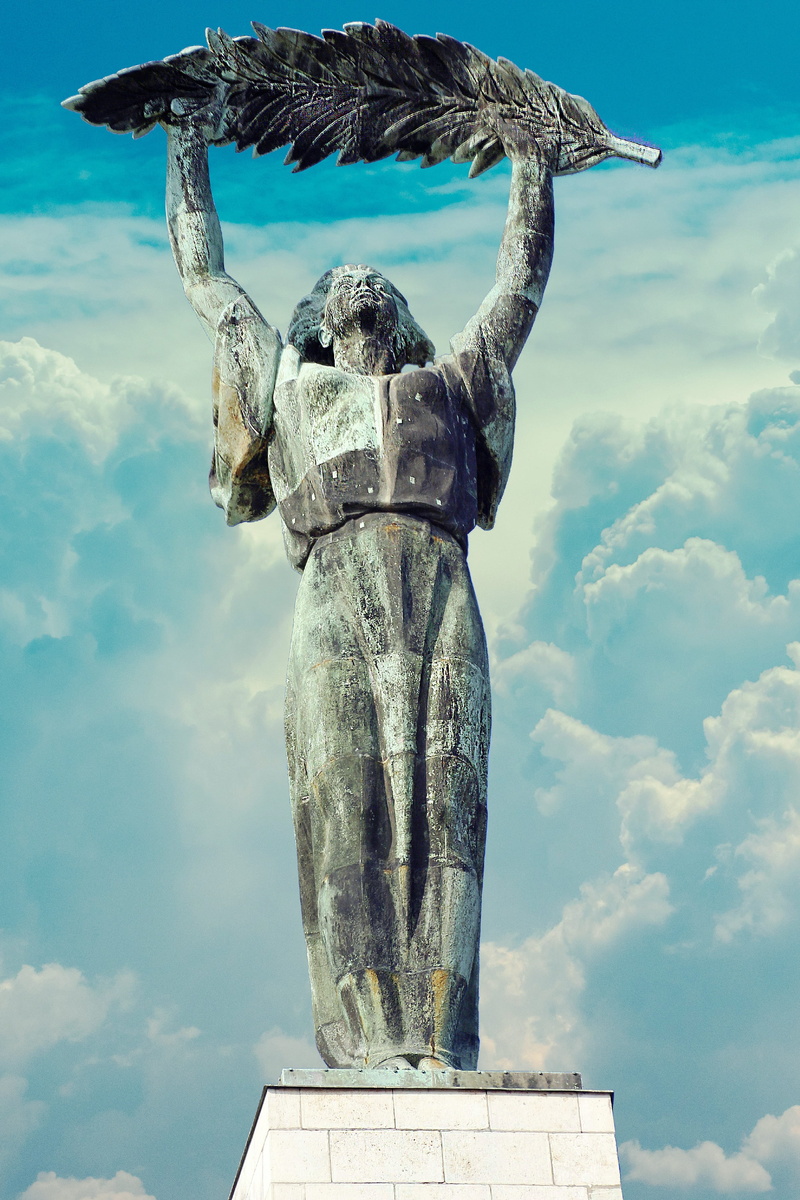 day, representation, carving - craft product, sculpture, city, angel, creativity, architecture, citadel, built structure, statue, no people, craft, hungary
