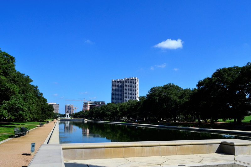 beige, blue, architecture, monumental, tree, clouds, clear sky, building, houston texas, office building exterior, pond, sky, man made, trees, modern, swimming pool