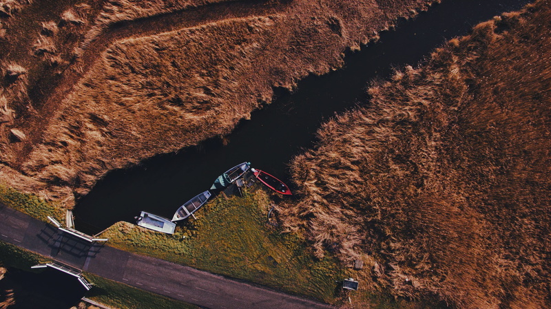 rock - object, mode of transportation, photo, from above, motor vehicle, photograph, four, day, no people, grass, aerial view, outdoors, land, three, travel