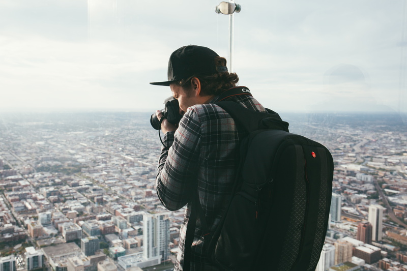 sports, warm clothing, plaid, photo, shirt, taking, dslr, lifestyles, cityscape, only men, cloud, daytime, young adult, architecture, buildings, leisure activity