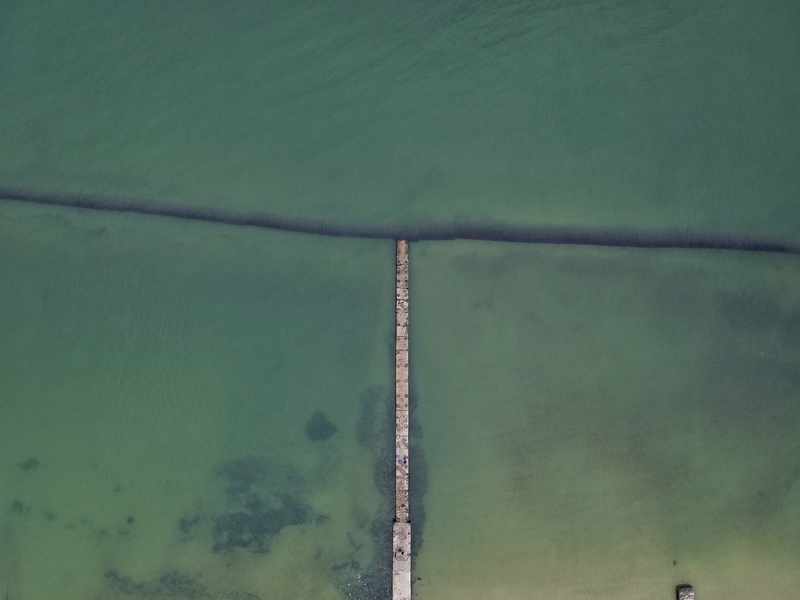 aerial, full frame, aerial view, green, daytime, surrounded, ocean, bridge, outdoors, sky, day, built structure, tree, plant, 4K, environment, pollution