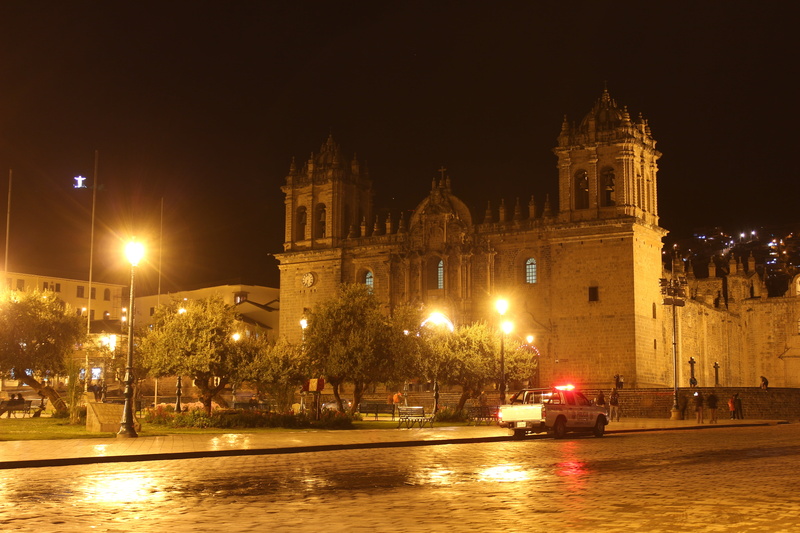 place of worship, motor vehicle, built structure, luggage, belief, government, night, travel, car, street light, mode of transportation, religion, city