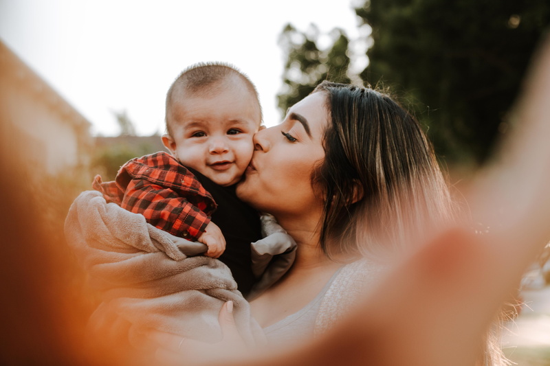 couple - relationship, childhood, woman, son, newborn, affectionate, positive emotion, togetherness, aunt, carrying, child, latina, golden hour, cheek