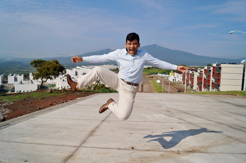 skip, joy, nature, sun, looking at camera, panorama, front, brown, housing complex, pavements, motion, young men, full length, outdoors, smiling, shadow