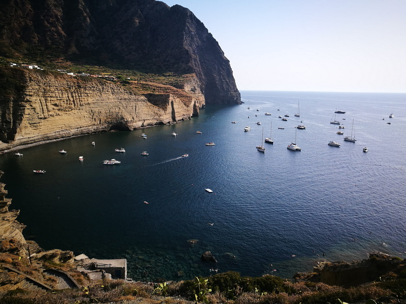 sea, tranquil scene, rock, summer, color, day, sky, sicily, italy, outdoors, island, no people, rocky coastline, nature, beauty in nature, boats, horizon over water