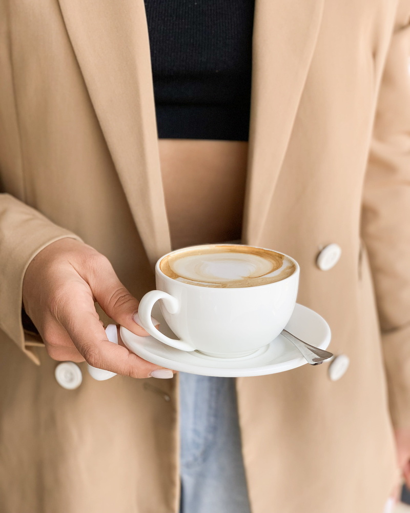 indoors, apparel, finger, table, saucer, close-up, human, tea cup, coffee, business, human body part, clothing, hot drink, coffee cup, hand, latte, holding