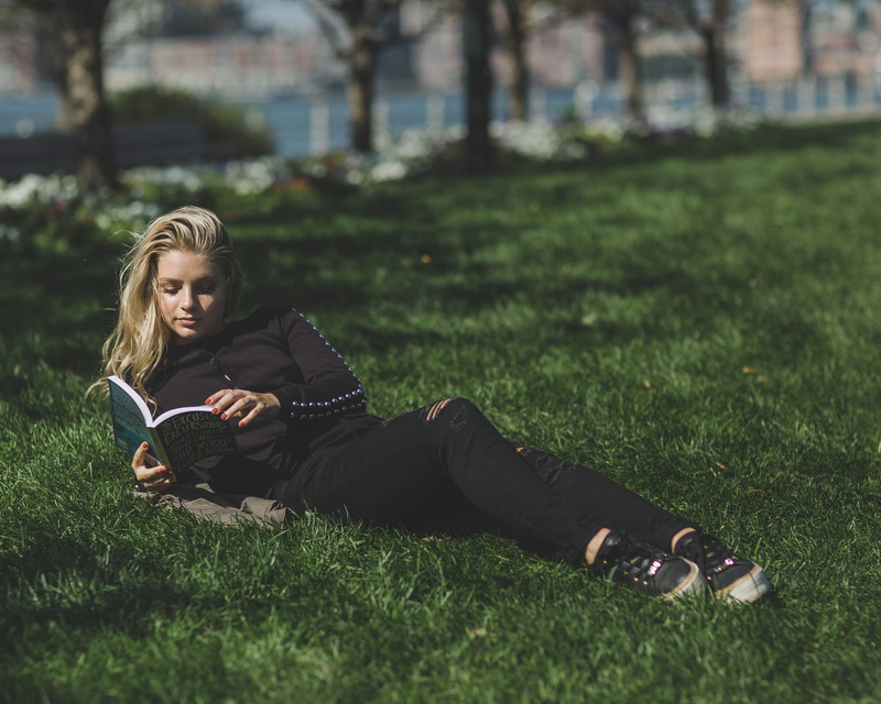mobile phone, smart phone, technology, green, field, full length, using phone, one person, long hair, young women, blonde, sleeved, travel book, reading