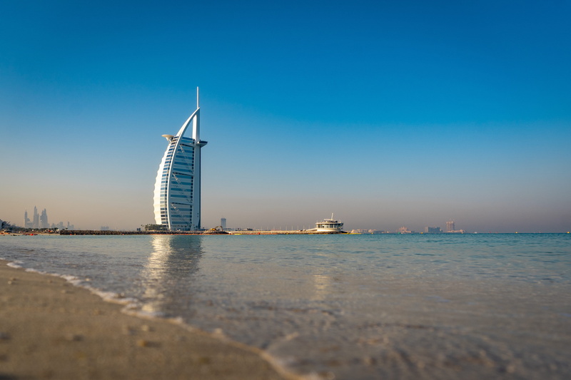 building exterior, land, architecture, waterfront, blue, sea, scenics - nature, burj, built structure, arab, luxury, nature, travel, clear sky, sailboat