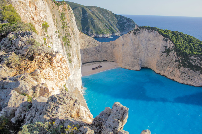calm, beach, bay, travel destinations, high angle view, beauty in nature, tourism, rock, formations, cliff, no people, daylight, tourist spot, sky, scenics - nature