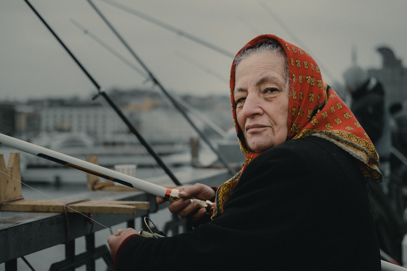 bow, clothing, woman, gun, turkish, fishing, lady, musical instrument, person, 5K, side view, portrait, red, mature adult, weaponry, one person, real people