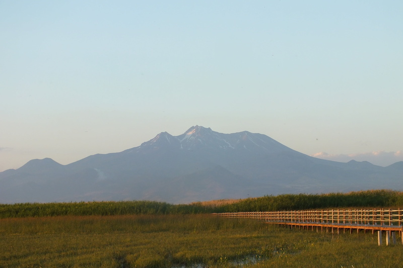 landscape, scenics - nature, sky, barrier, beauty in nature, plant, mountain range, field, clear sky, wooden houses, outdoors, nature, grass, mountains