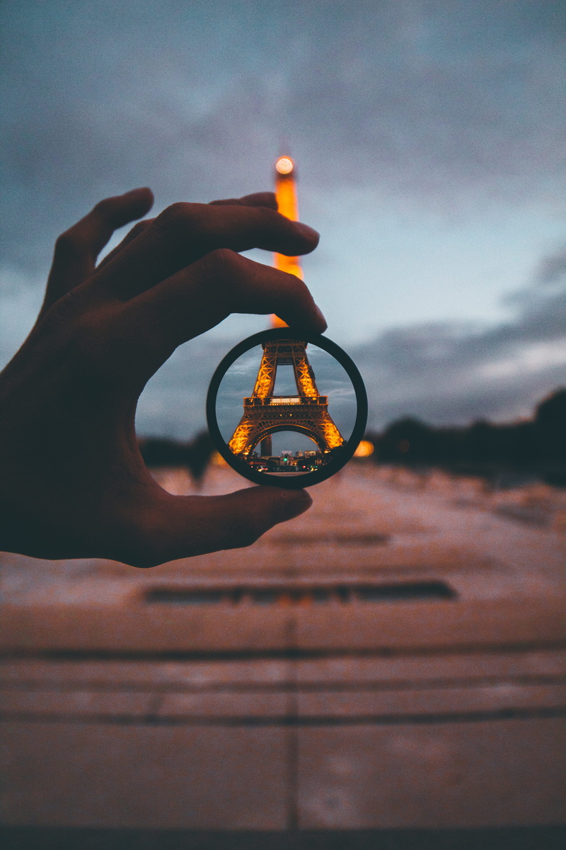 lens, urban, real people, paris, moody, holding, eiffel, anywhere, cloud - sky, one person, view, bangle, focus, selective, close-up, eiffel tower, circular