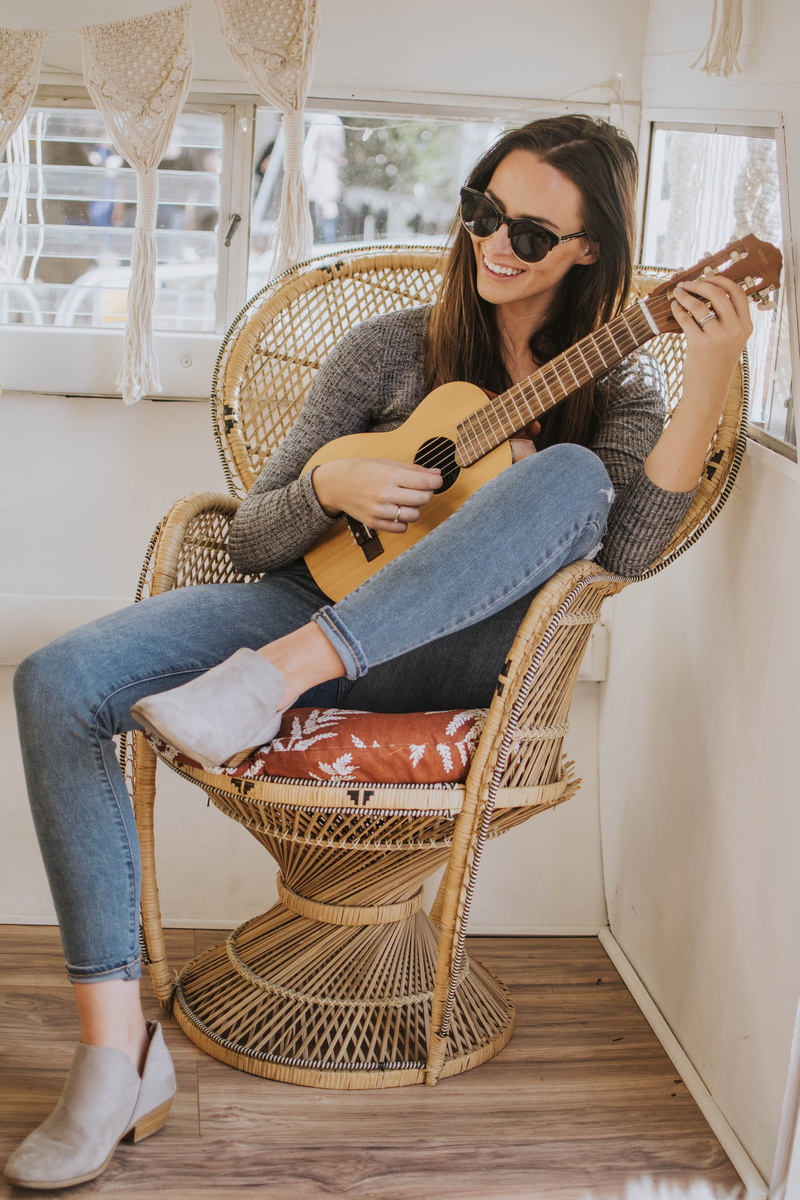 real people, boho chair, ukulele, lifestyles, acoustic guitar, smiling, decor, full length, leisure activity, hairstyle, casual clothing, camper, happy