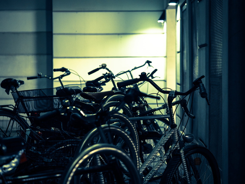 focus on foreground, architecture, chrome, no people, bicycle, Bike Racks, day, wall, parking, built structure, close-up, lined up, bike, steel, parking lot