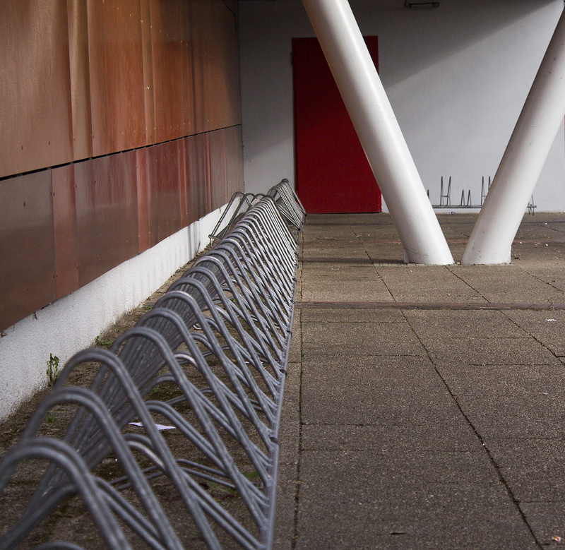 Bike Racks, tiled floor, railing, no people, metal, built structure, anchored, staircase, building, architecture, industry, grey, steel, sunlight, side by side