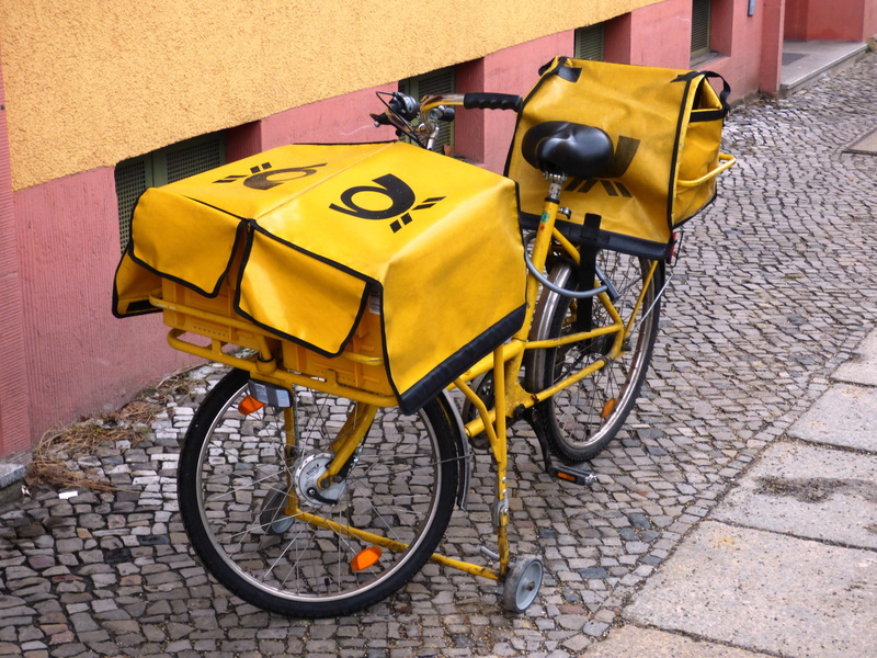 wheel, outdoors, beside, day, Bike, yellow, no people, email, Letter, street, built structure, stationary, wall, paving stone, mode of transportation, transportation