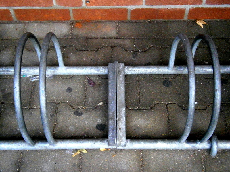 bike, pattern, no people, parking possibility, architecture, outdoors, wall, built structure, shape, old, wall - building feature, side by side, bike racks