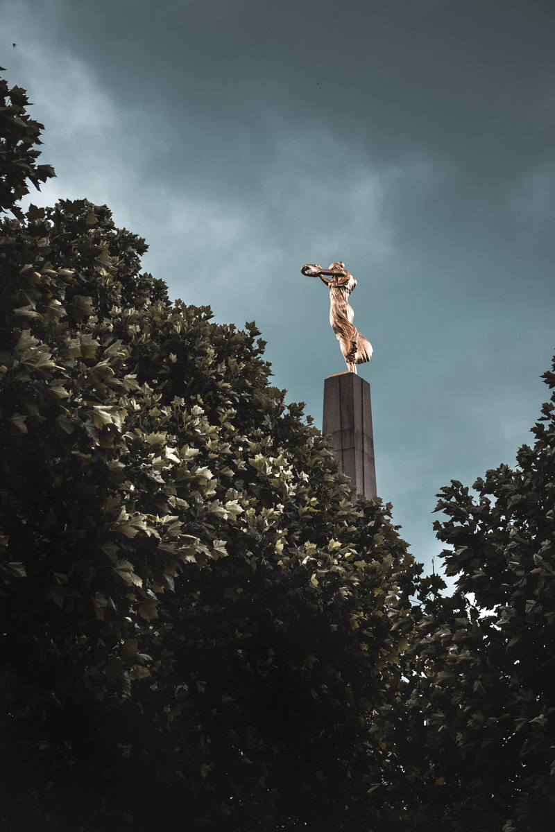 obelisk, city, art and craft, one person, low, leisure activity, statue, growth, human representation, photography, art, 5K, sky, column, building, sculpture