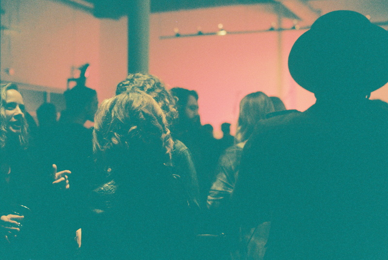 women, standing, crowd, light, filmisnotdead, lifestyles, real people, film, building, nightlife, adult, text, story, inside, youth culture, dark, party