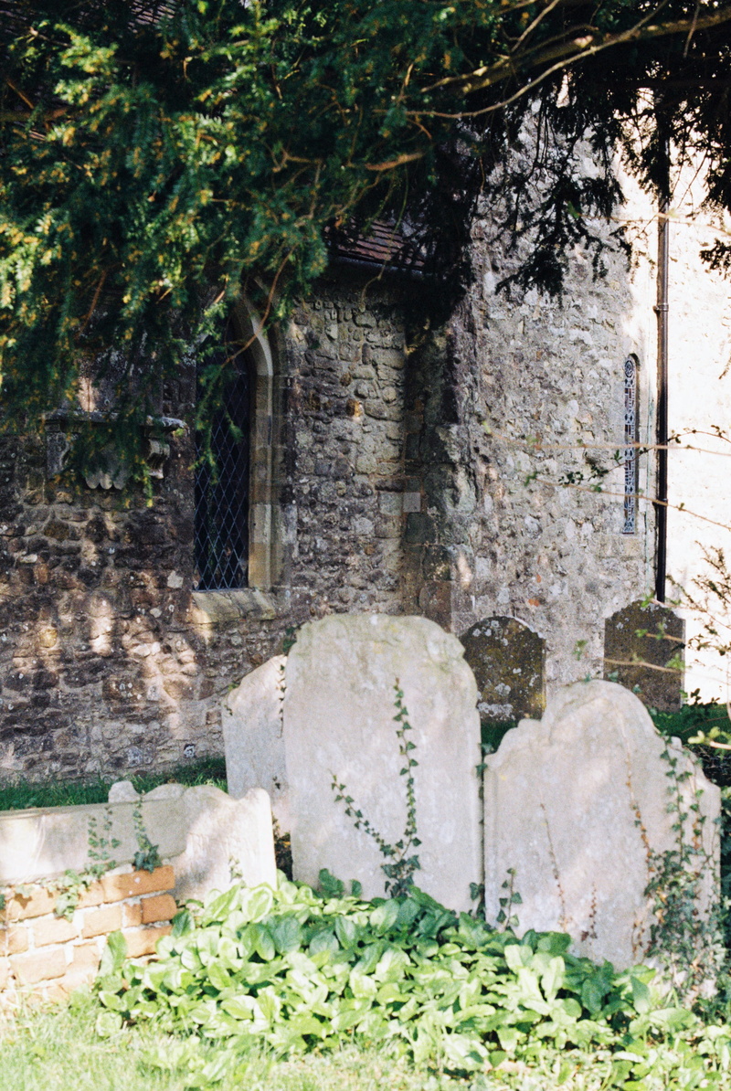 building exterior, day, arbour, solid, restaurant, patio, stone material, stone wall, film photo, analog, 4K, tomb, wall, church, slate, outdoors, flagstone
