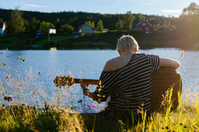 travel, fall, string instrument, houses, sunlight, romantic, grass, leisure activity, one person, 4K, recreation, scenic, day, water, relaxation, beauty in nature