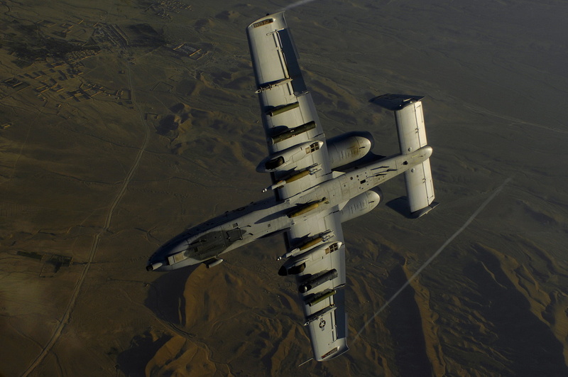mountain, bomber, built structure, air vehicle, mode of transportation, flying, scenics - nature, aerospace industry, outdoors, A-10, military, no people