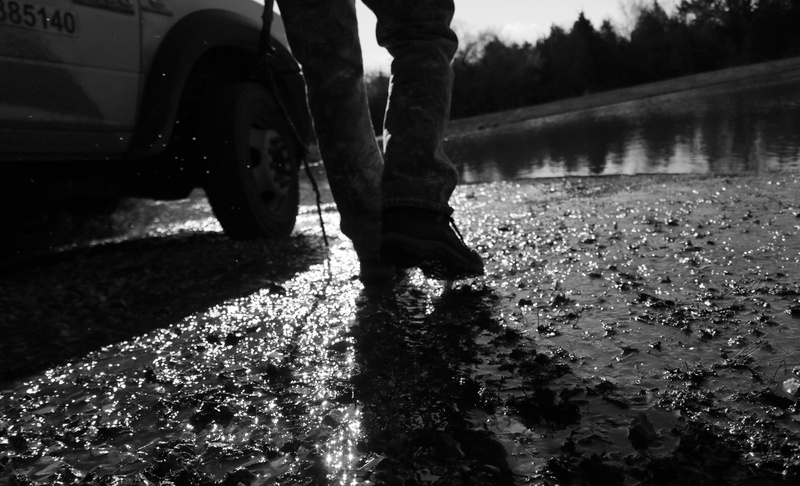 day, truck, water, low section, lifestyles, human body part, boots, one person, body part, wildwood, human leg, men, trout, jeans, united states, pond