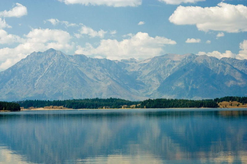 non-urban scene, tree, mountain, beauty in nature, clouds, travel destinations, Yellowstone National Park, lake, landscape, sky, cloud - sky, park, nature