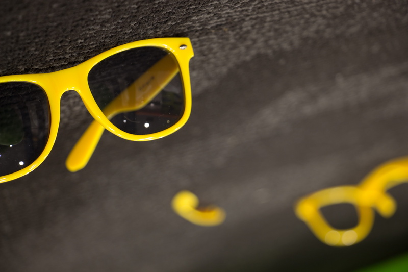 close-up, revert, single object, focus on foreground, no people, glasses, sunglasses, conceptual, indoors, eyewear, 5K, fashion, day, yellow, eyesight