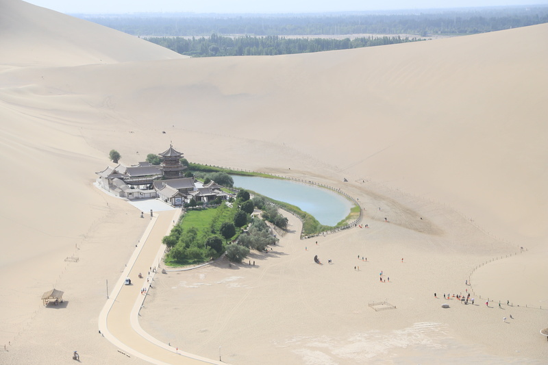 climate, desert, beauty in nature, crescent lake, tourism, landscape, environment, building exterior, day, built structure, high angle view, non-urban scene