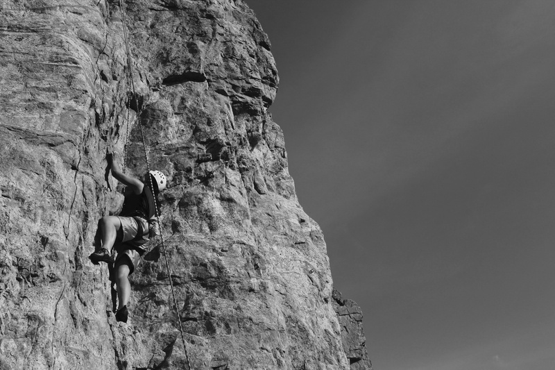 cliff, rock climbing, formation, tree, real people, skaha lake, lifestyles, rock formation, low angle view, solid, man, sport, nature, climbing, mountain