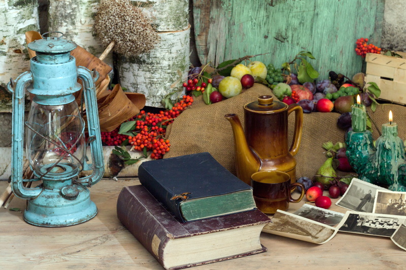 bottle, food and drink, kerosene lamp, book, healthy eating, container, candles, flower, antique, two, indoors, no people, glass, fruit, large group of objects
