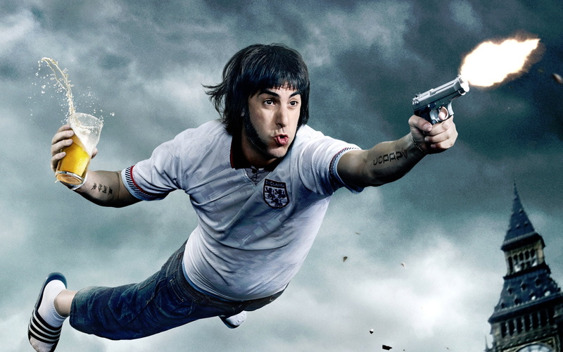 cohen, nature, baron, cloud - sky, Hollywood Movies, architecture, sacha baron cohen, looking at camera, holding, young men, 2016, weapon, motion, communication