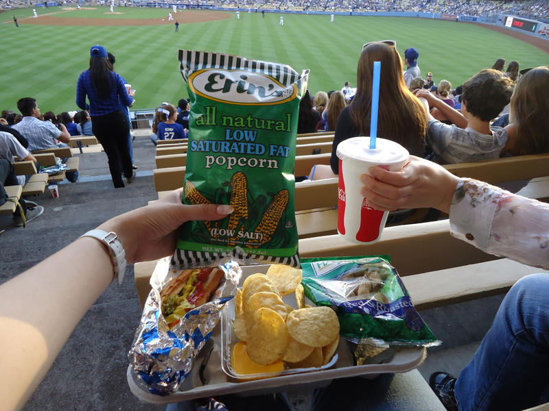 adult, dodgers, human body part, men, hand, day, people, outdoors, human hand, holding, freshness, leisure activity, baseball, temptation, soda, group of people