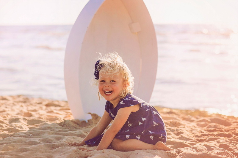 land, nature, leisure activity, laughing, innocence, sea, child, outdoors, real people, sunlight, 1080P, looking at camera, sand, one person, emotion