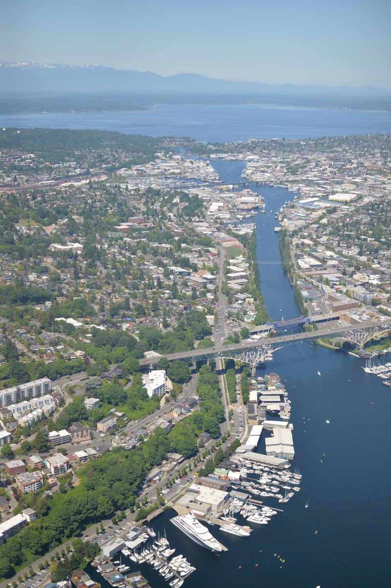 cityscape, mountains, architecture, outdoors, built structure, environment, united states, seattle, water, sky, residential district, fremont, kayak, view from above