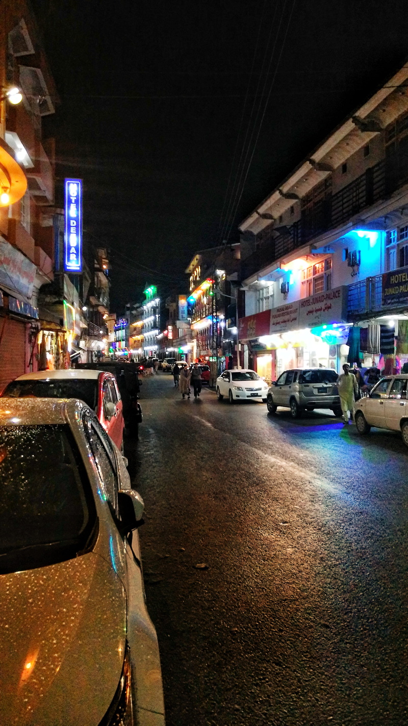 architecture, mode of transportation, traffic, land vehicle, stationary, incidental people, city, pakistan, motor vehicle, building exterior, night, bahrain