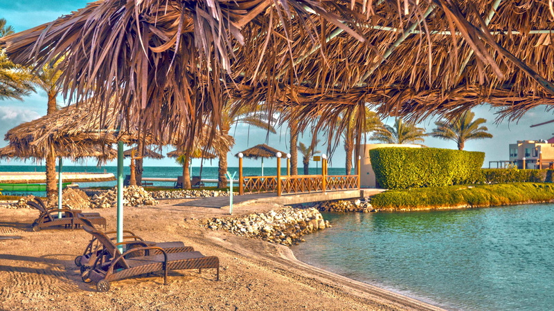 built structure, palm tree, tropical climate, no people, vacations, shore, day, Beach, nature, seaside, landscape, blue, thatched roof, roof, land, wooden