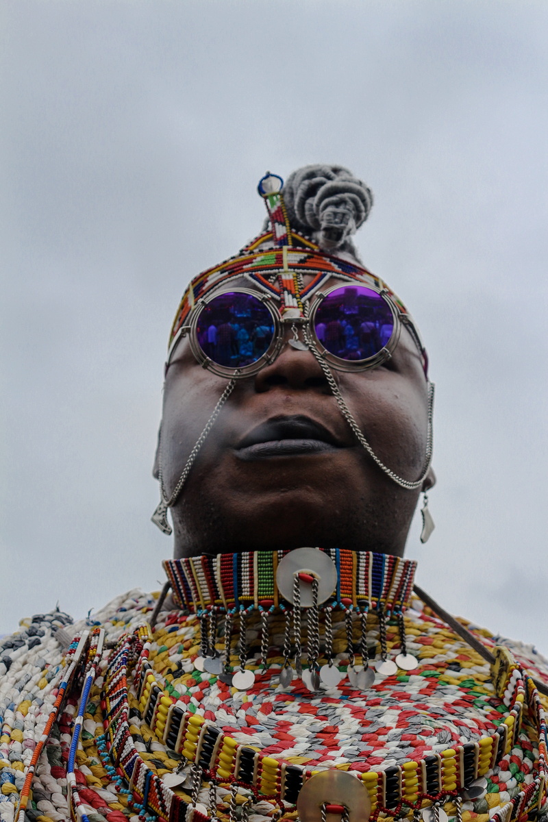 person, necklace, jewelry, food, human face, finger, multi colored, representation, crowd, men, art and craft, accessory, front view, human representation