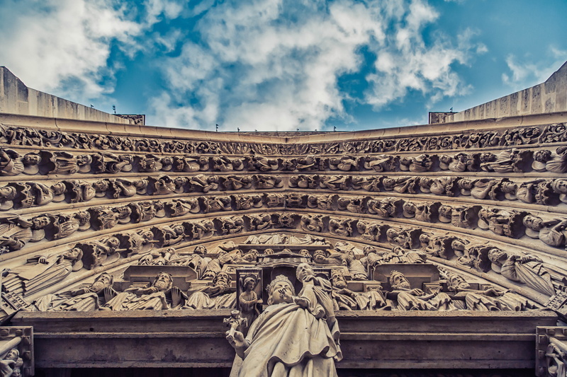 cityscape, representation, craft, architecture, low angle view, history, bas relief, day, travel, blue, notre dame, church, paris, city, cloud - sky, building exterior