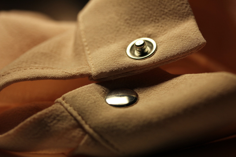 macro, studs, ata, button, textile industry, 2K, full frame, leather, luxury, close-up, bi, coat, bag, indoors, pocket, fashion, studio shot, elegance