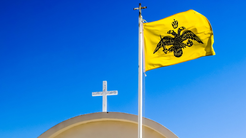communication, environment, waving, byzantium, low angle view, pole, sky, sign, copy space, outdoors, two-headed eagle, day, clear sky, flag, no people