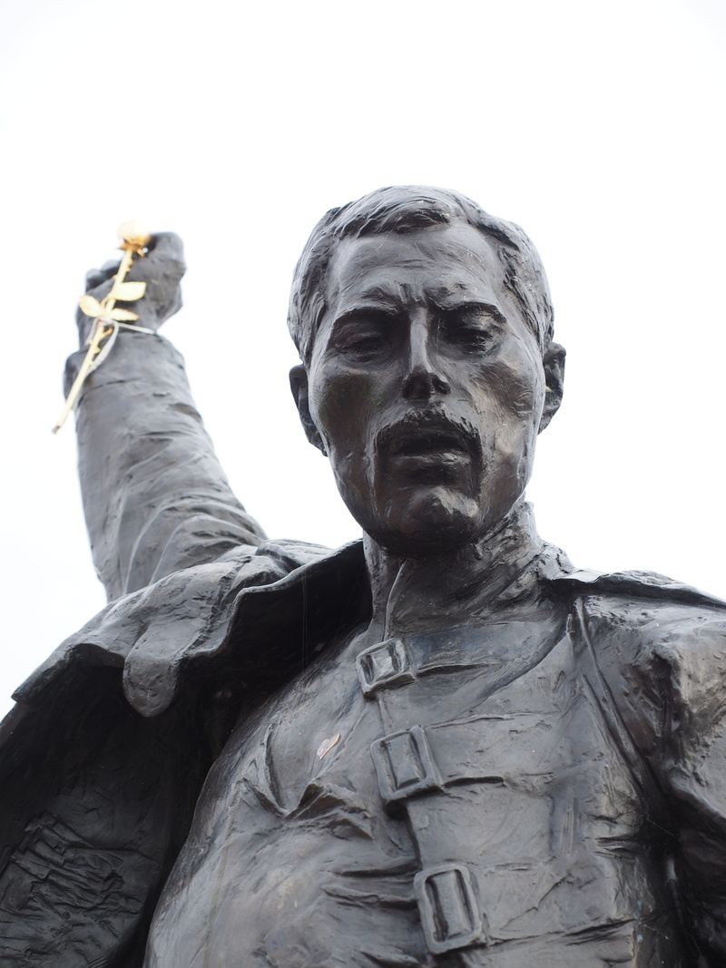 4K, army, one man only, singer, clear sky, male likeness, famous Place, adult, memorial, human representation, low angle view, sky, Freddie Mercury, creativity