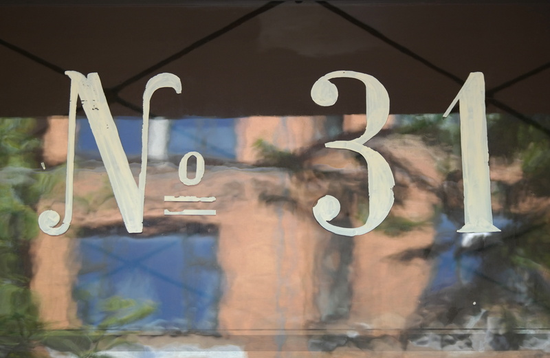 sign, western script, glass - material, frederiksberg, 31, focus on foreground, architecture, no people, day, nature, text, reflection, built structure