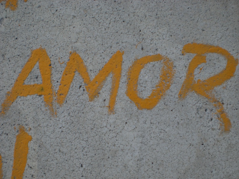 communication, spray paint, single word, sign, capital letter, gray, wall - building feature, outdoors, no people, street, architecture, message, western script