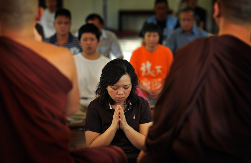 culture, homage, sitting, temple, females, respectfully, mid adult, belief, religion, religious, incidental people, indoors, women, buddhist, people, candle