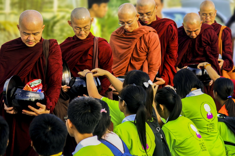 good deeds, street, large group of people, monks, adult, meritorious, merit, soccer, rear view, real people, sport, red, day, men, sangha, theravada monks in alms-round