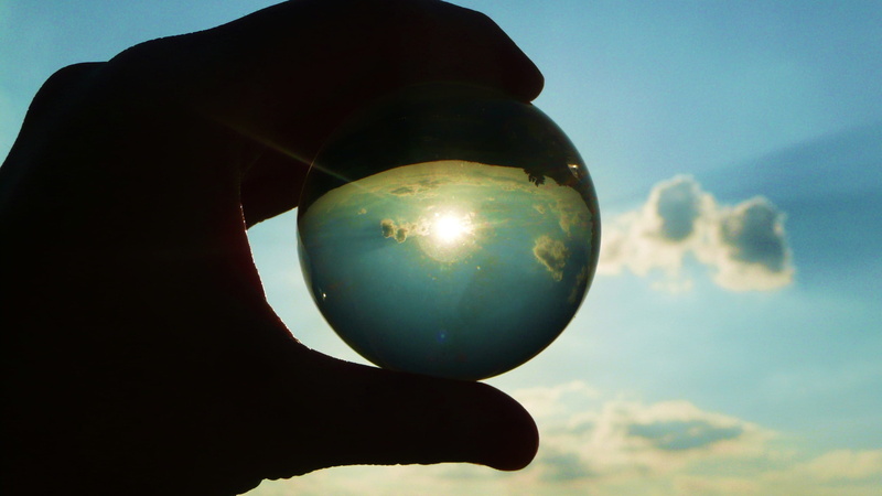 round, person, human body part, decoration, reflection, nature, human hand, transparent, glass - material, cloud, low angle view, close-up, one person